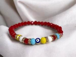 PULSERA FACETADA ROJA CON OJO TURCO Y STRAS