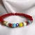 PULSERA FACETADA ROJA CON OJO TURCO Y STRAS